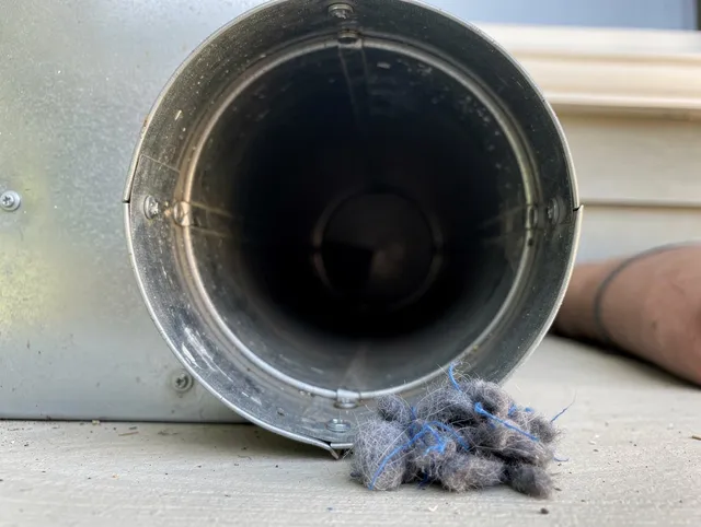 Santa Monica Dryer Vent Cleaning technician using specialized equipment to clear severe dryer vent blockage in Santa Monica